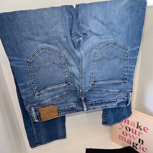 Classic Blue Boot Cut Jeans with Distressed Details